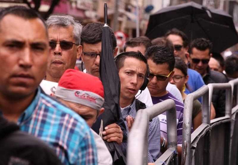 People line up to vote in Corferias, the biggest polling station of the country, in Bogota, Colombia, 27 May 2018. 