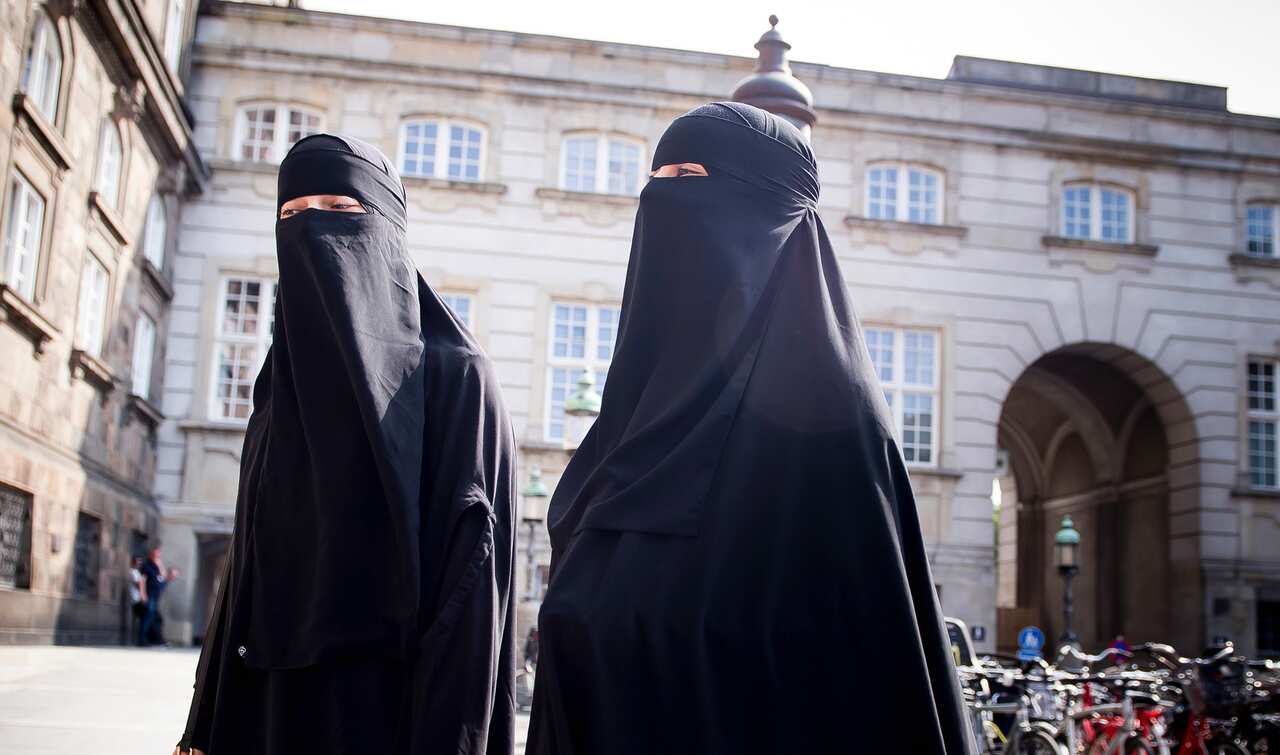 Women in niqab in front of the Danish Parliament at Christiansborg Castle in Copenhagen, Denmark, Thursday May 31. 2018. 