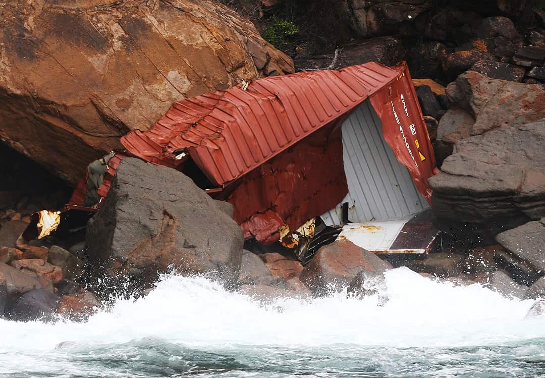 A container from the ship YM Efficiency is seen washed up on Yacaaba Headland.