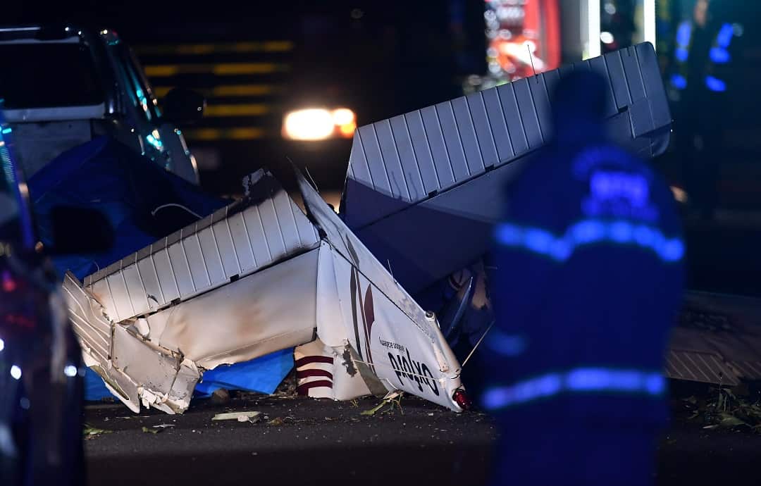 The wreckage of a light plane is seen in Melbourne.