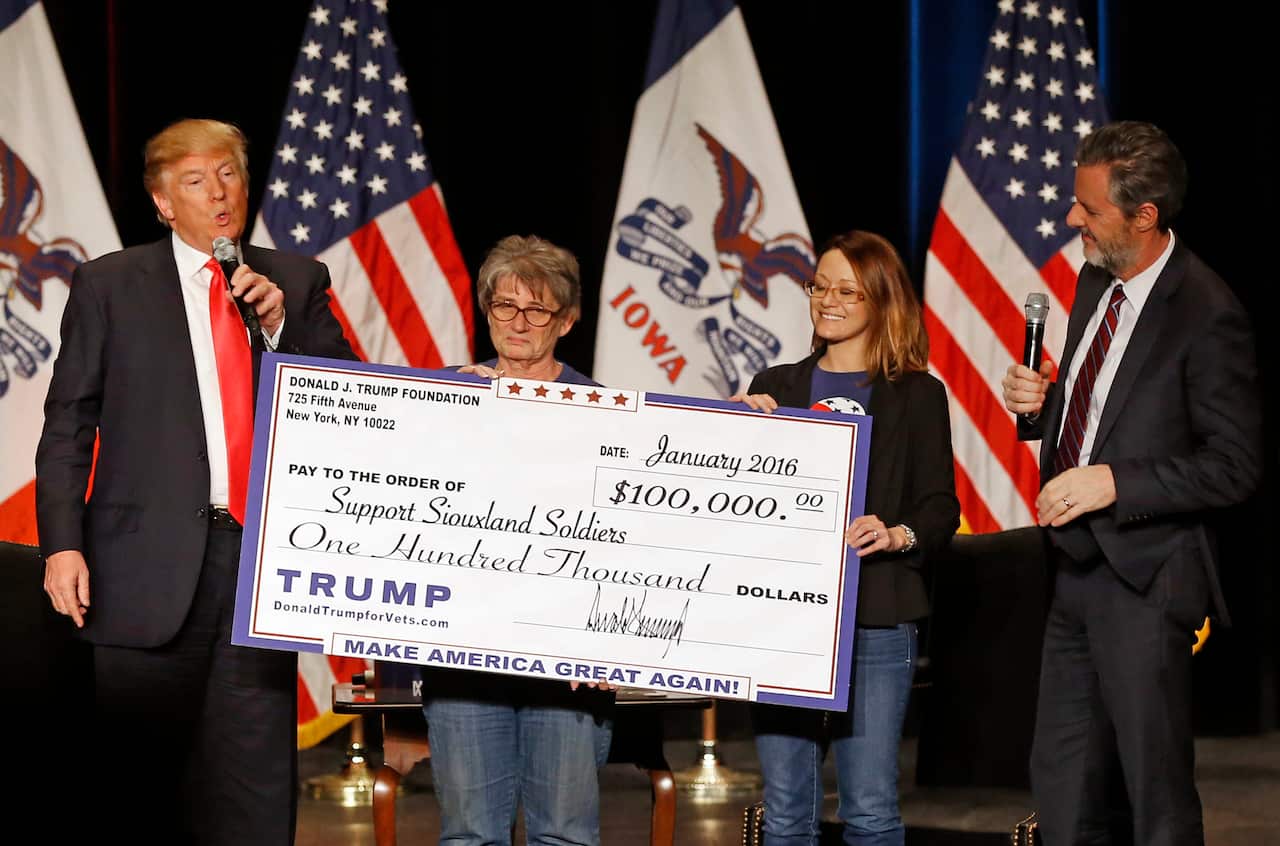 Donald Trump on stage with Jerry Falwell, Jr., right, president of Liberty University. 