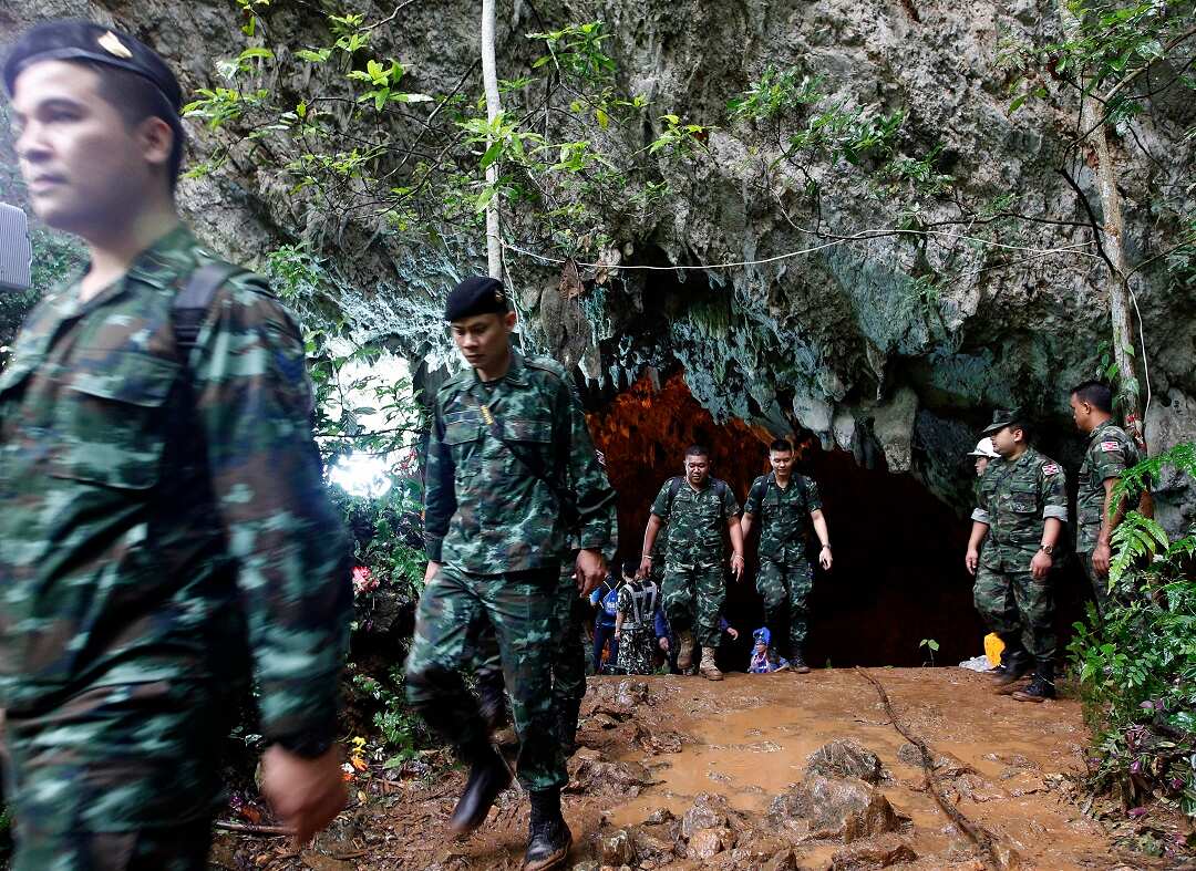 Thai military personnel at the entrance of the cave.