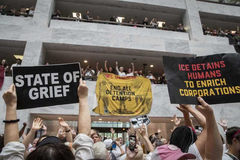 Hundreds of activists protest the Trump administration's approach to illegal border crossings and separation of children from immigrant parents, in the Hart Senate Office Building on Capitol Hill in Washington, Thursday, June 28, 2018.