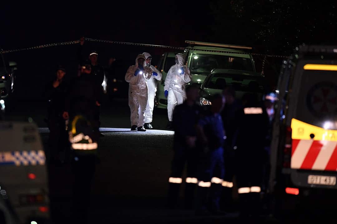 NSW Police and Forensic Services attend the scene of a shooting.