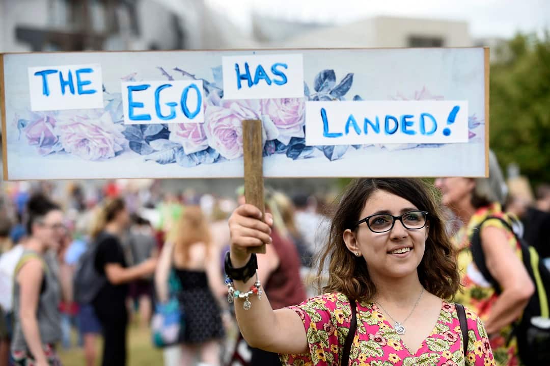 Scotland United Against Trump demonstrators gather at the Scottish Parliament.