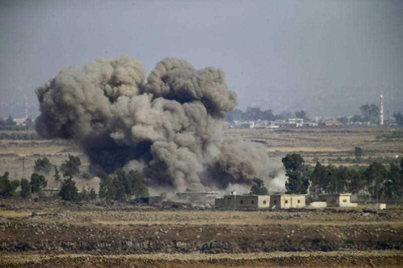 Smoke and explosions from the fighting between forces loyal to Syrian President Bashar Assad and rebels in the Darra province can be seen from the Israeli-controlled Golan Heights, Wednesday, July 25, 2018.