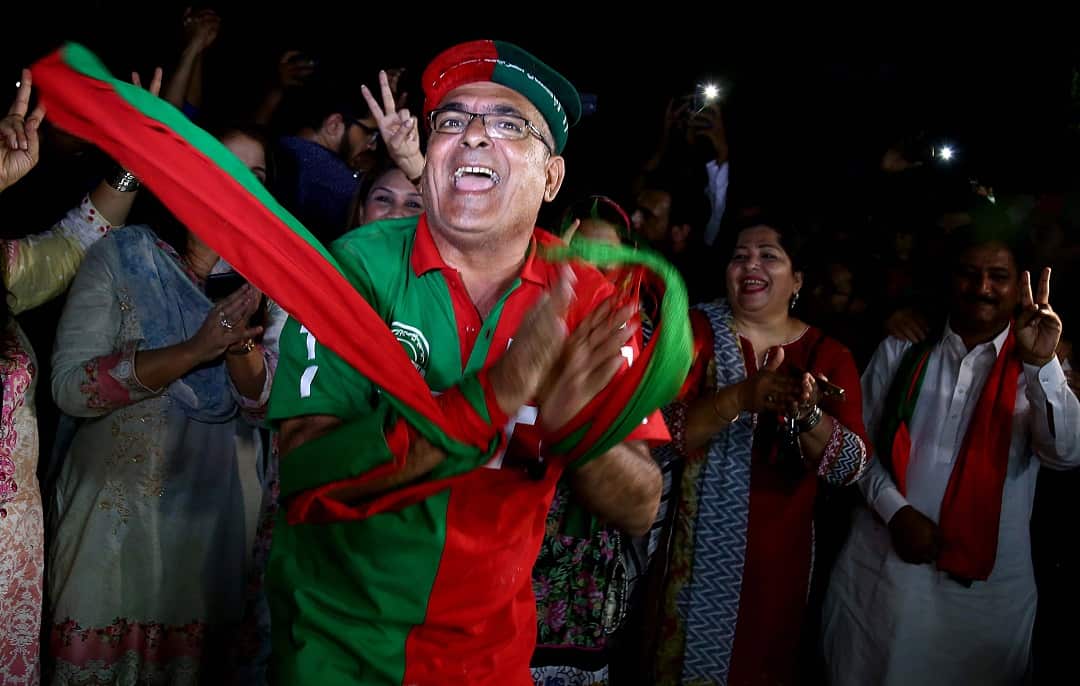 Supporters celebrate in Karachi.