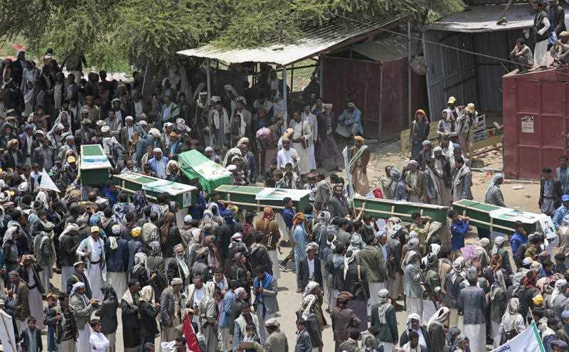 Yemeni people carry the coffins of victims of a Saudi-led airstrike, during a funeral in Saada, Yemen, Monday, Aug. 13, 2018.