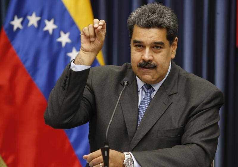 Venezuela's President Nicolas Maduro demonstrates his Salt Bae sprinkling technique during a press conference at the Miraflores Presidential Palace, in Caracas, Venezuela, Tuesday, Sept. 18, 2018. Venezuela's President Nicolas Maduro demonstrates his Salt Bae sprinkling technique during a press conference at the Miraflores Presidential Palace, in Caracas, Venezuela, Tuesday, Sept. 18, 2018.