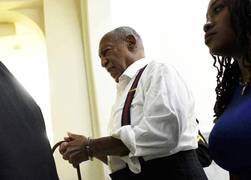 Bill Cosby is taken away in handcuffs.