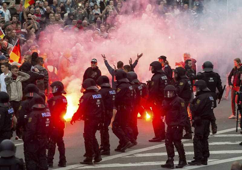 German riot police confront far-right protesters in the city of Chemnitz.