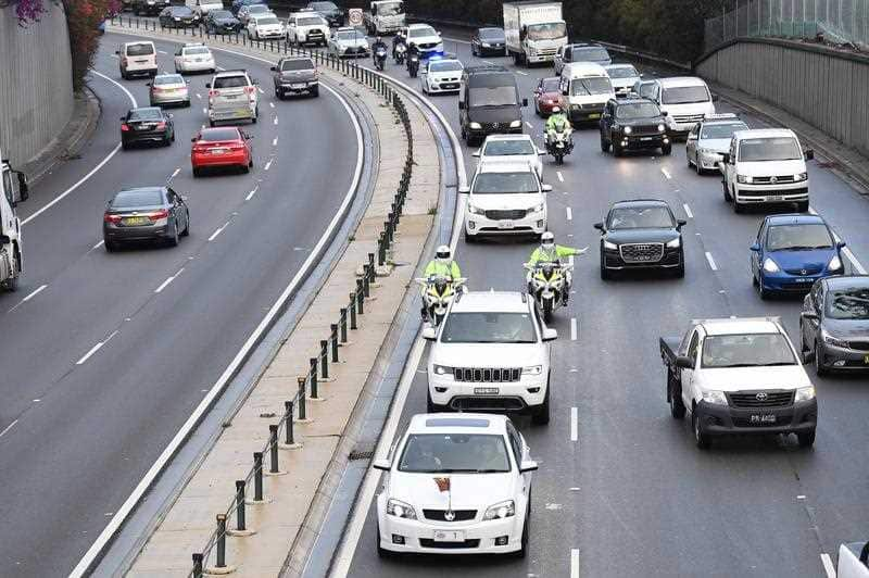 The motorcade carrying the Duke and Duchess of Sussex makes its way through peak hour traffic in Sydney. 