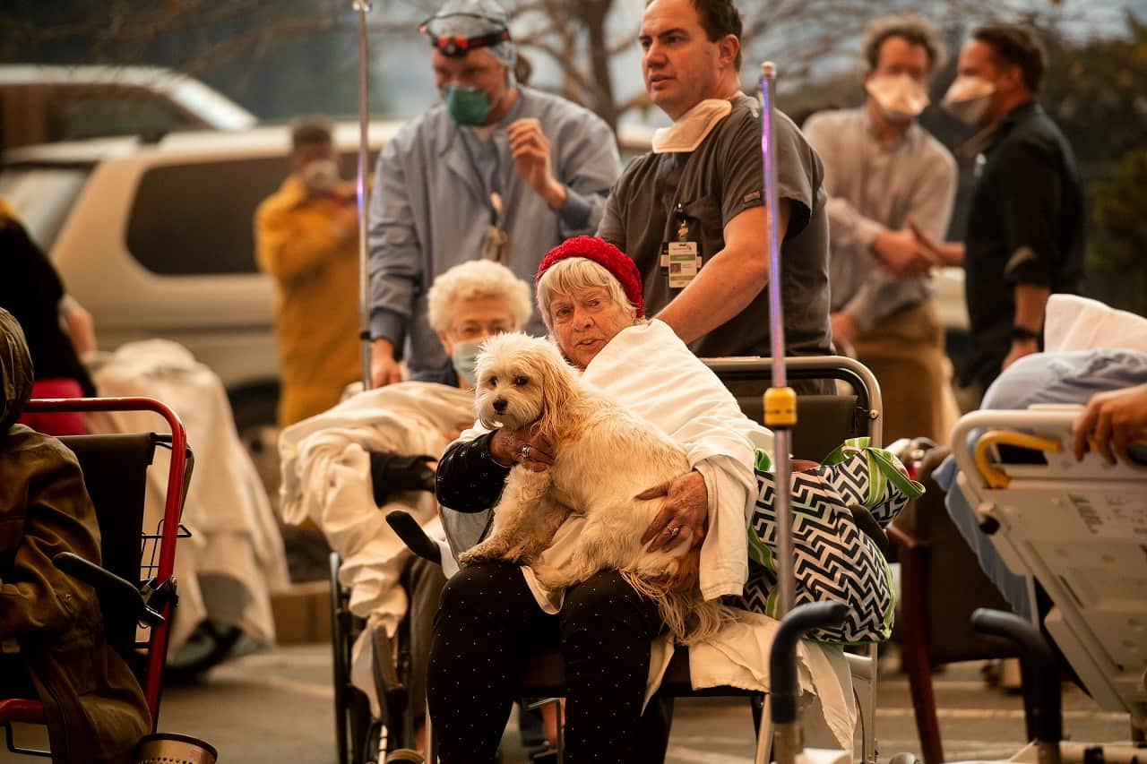 Medical personnel evacuate patients from the the Feather River Hospital.