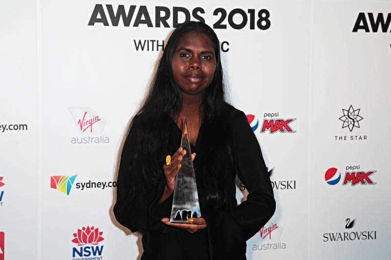 Jasmine Yunupingu poses for a photograph after her father Gurrumul won the Best Male Artist and Best Independent Release of the year during the 32nd ARIA Awards