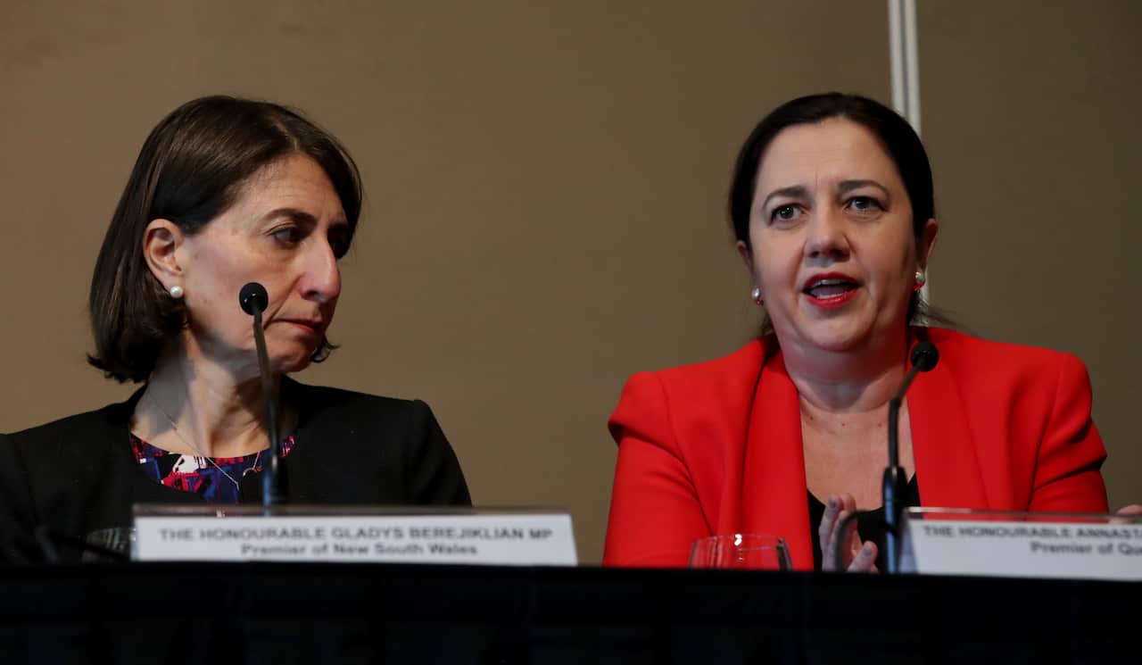 Premier of NSW Gladys Berejiklian and Premier of Queensland Annastacia Palaszczuk, speak with the media after the Council of Australian Governments (COAG) meeting in Adelaide, Wednesday, 12 December 2018. (AAP Image/Kelly Barnes) NO ARCHIVING