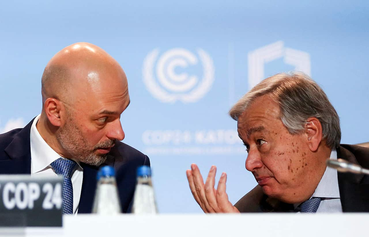 UN Secretary-General Antonio Guterres, right, talking to UNclimate conference president, Polish Deputy Environment Minister Michal Kurtyka.