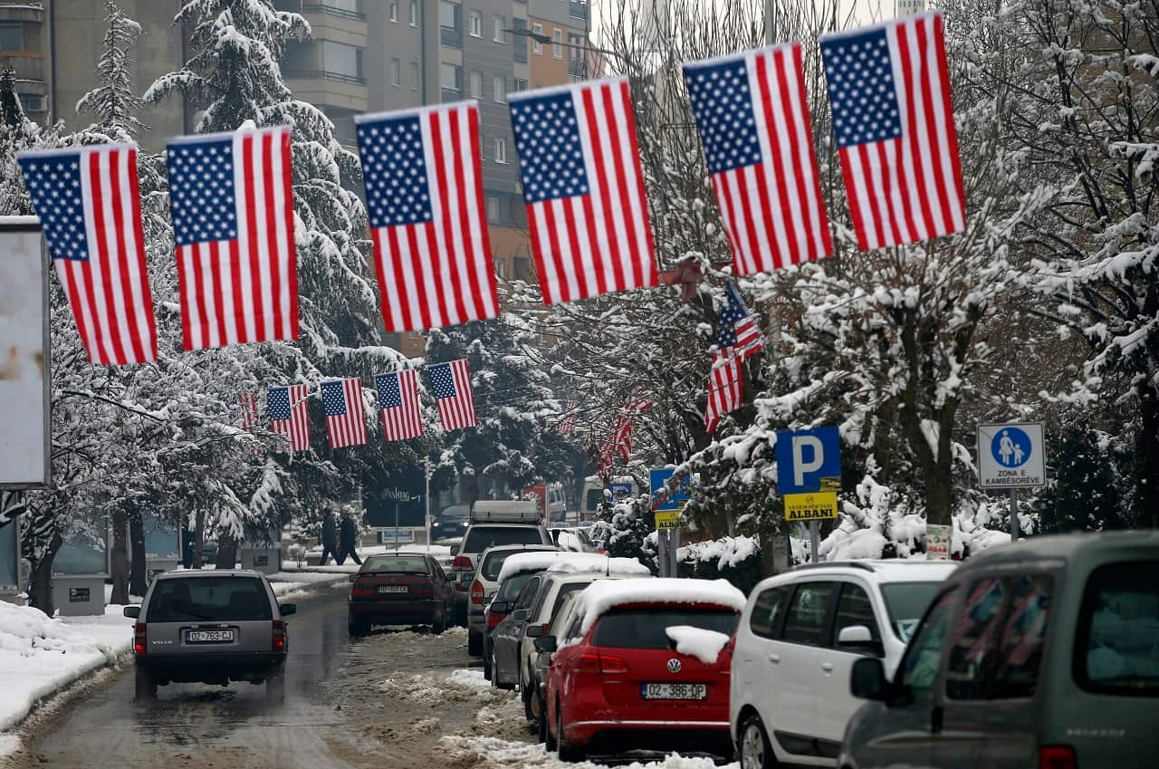 A street decorated with American flags in Mitrovica, Kosovo.