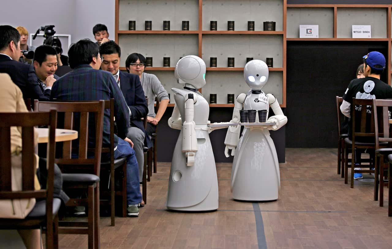 Robots serve customers at cafe in Tokyo, Japan.  