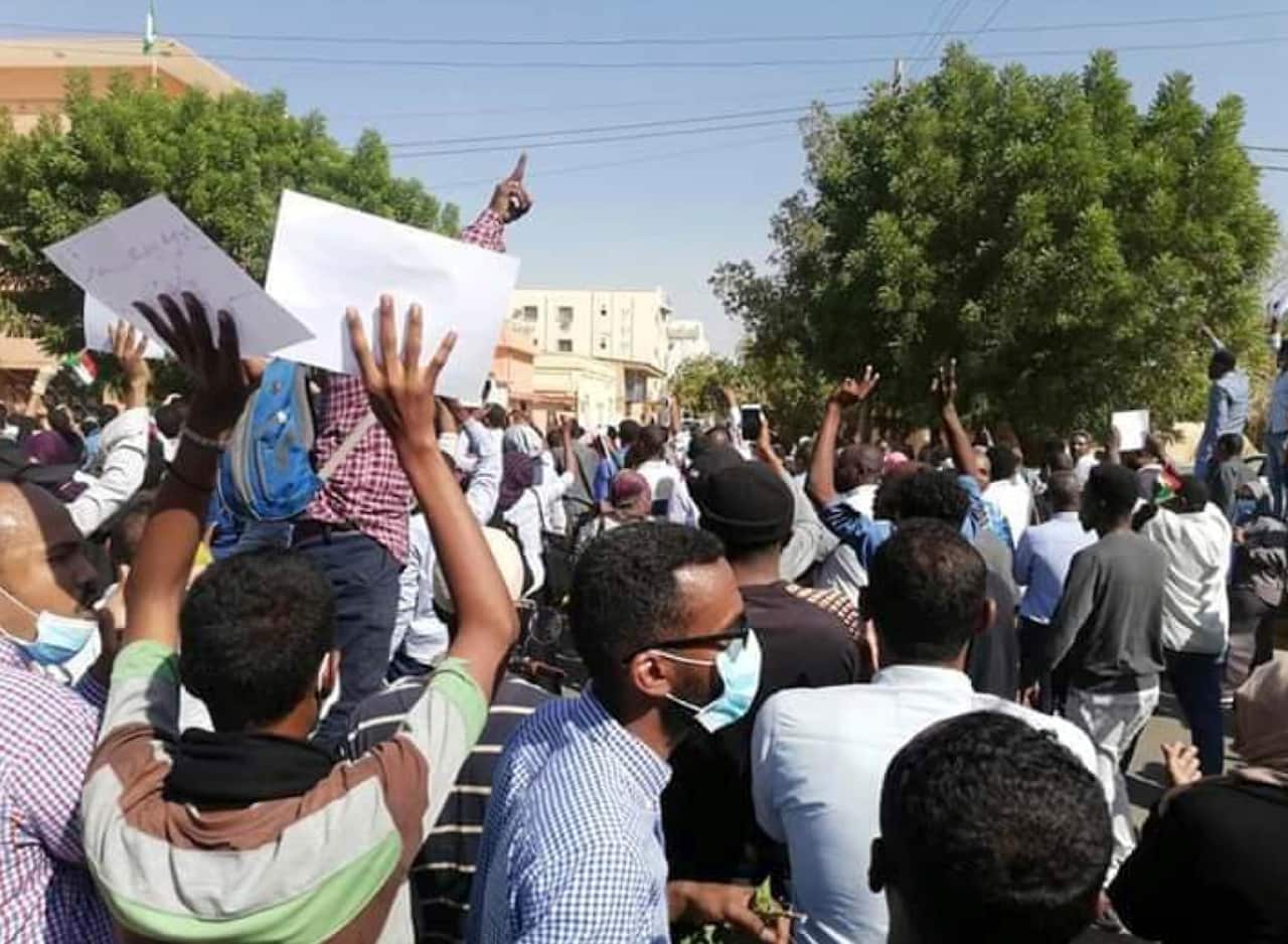 A Sudanese activist, people chant slogans during a demonstration in Khartoum, Sudan.