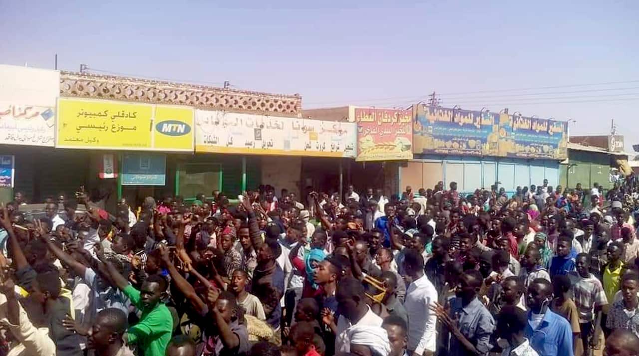 A Sudanese activist, people chant slogans during a demonstration in Kordofan, Sudan.