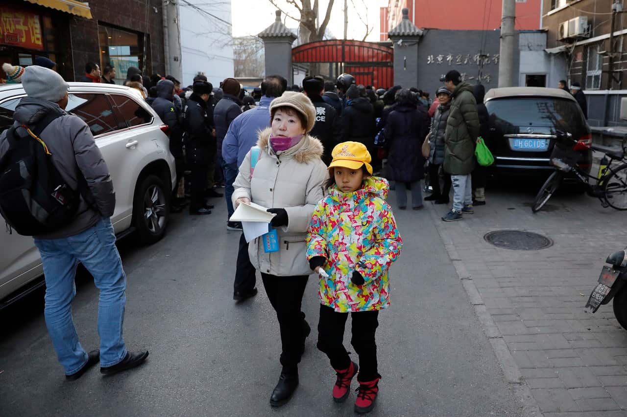 Children leave the school after the incident.