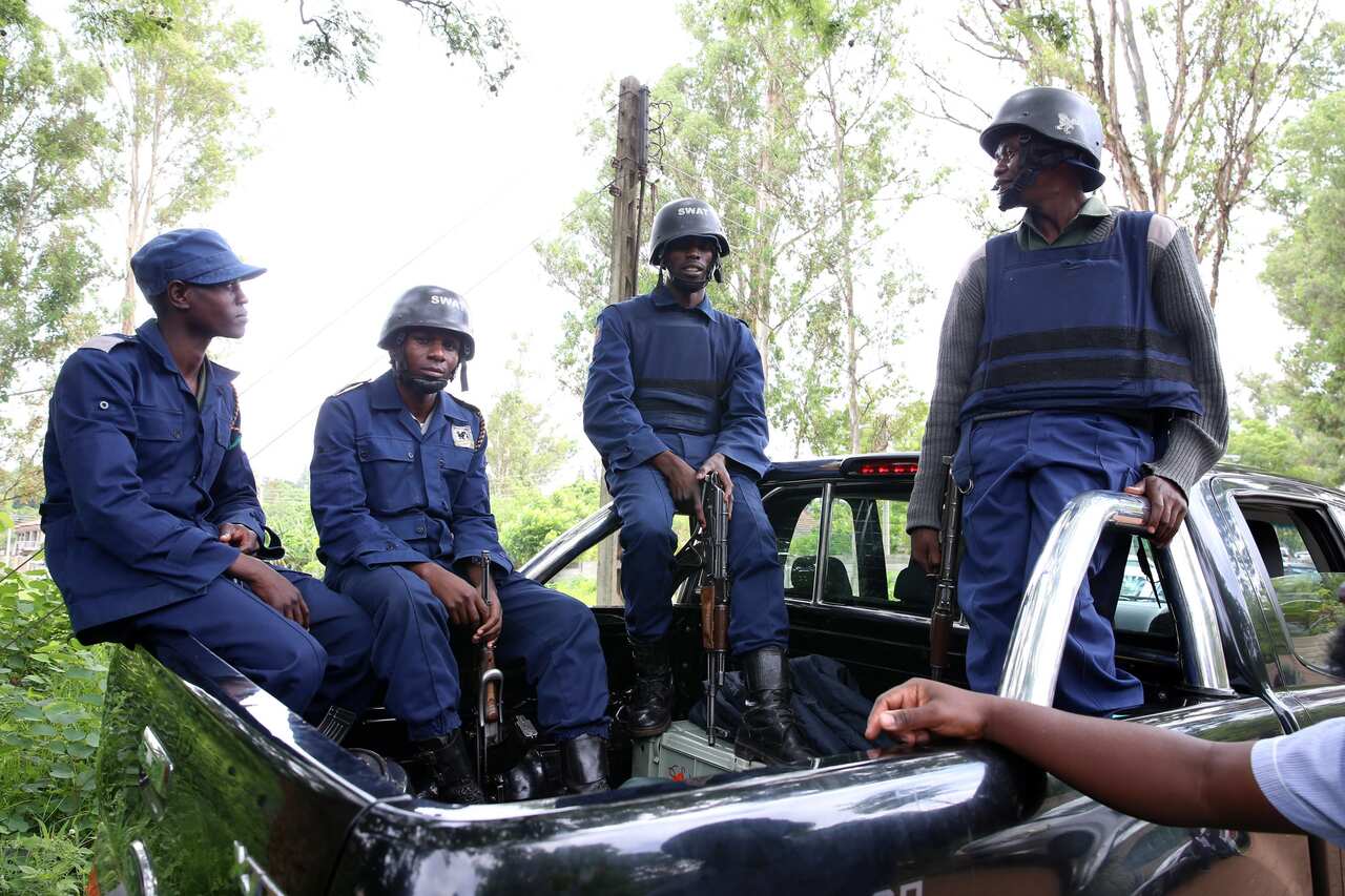 Armed police officers camp outside activist and pastor Evan Mawarire's house to arrest  him.