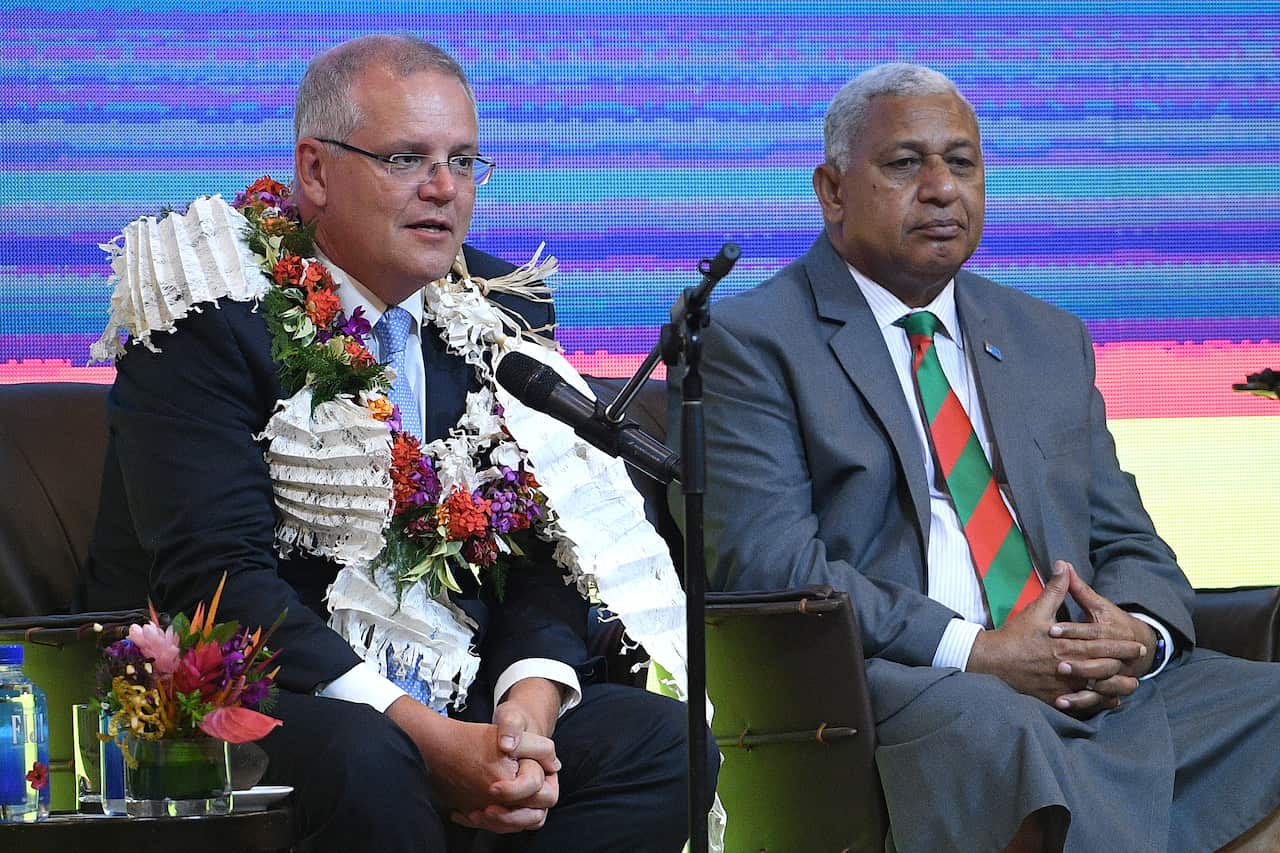 Prime Minister Scott Morrison (left) sits with Fiji Prime Minister Frank Bainimarama (right). The government hopes to strengthen ties with Fiji.