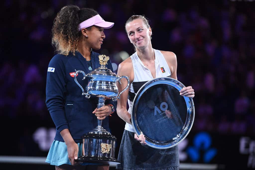 Naomi Osaka holds the Australian Open trophy alongside Petra Kvitova