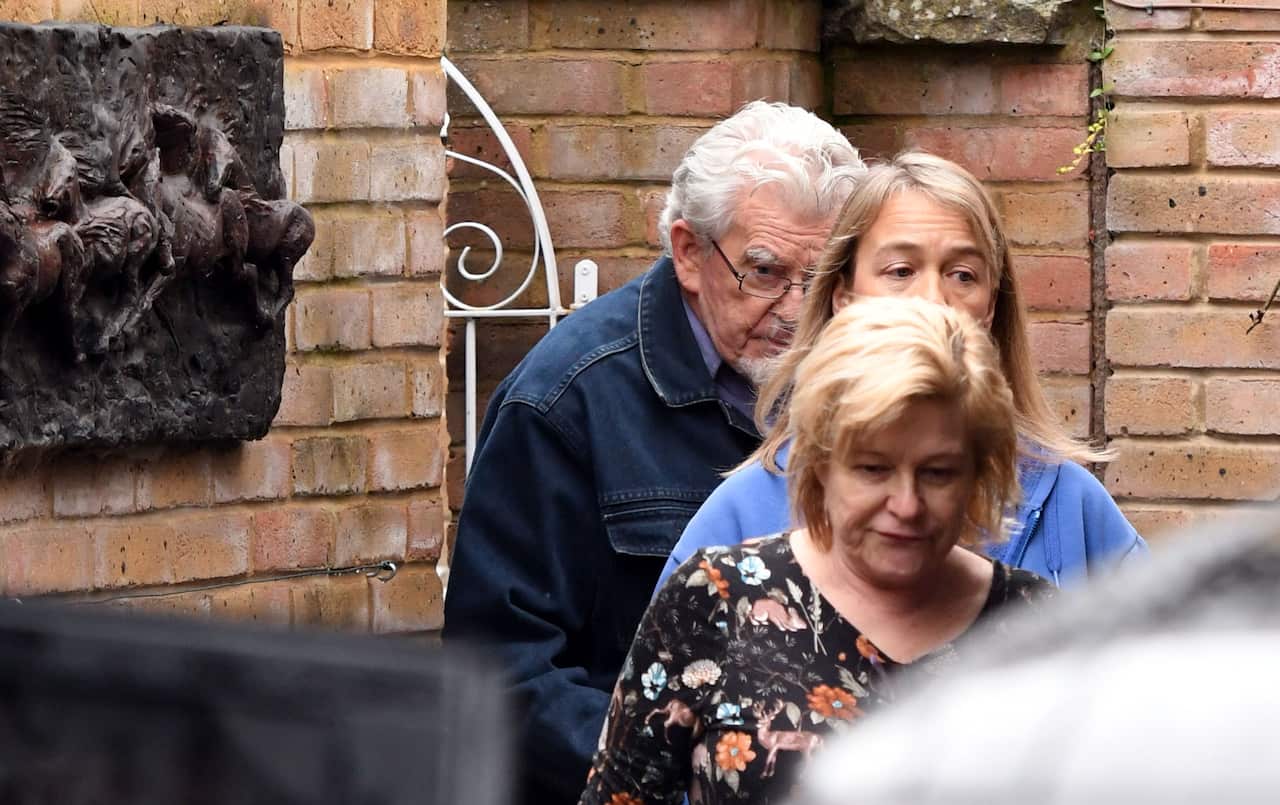 Rolf Harris outside his home in Bray, Maidenhead, as officials investigate his visit to a primary school. 