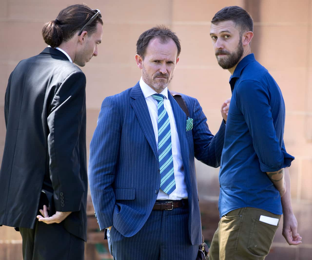 (centre) Andrew Bradley, brother of Cameron Bradley alleged murder victim of Henry Walcott outside Supreme Court in Sydney, Monday, February 11, 2019. Henry Walcott, 30, has pleaded not guilty - on the grounds of self-defence - to murdering Cameron Bradle