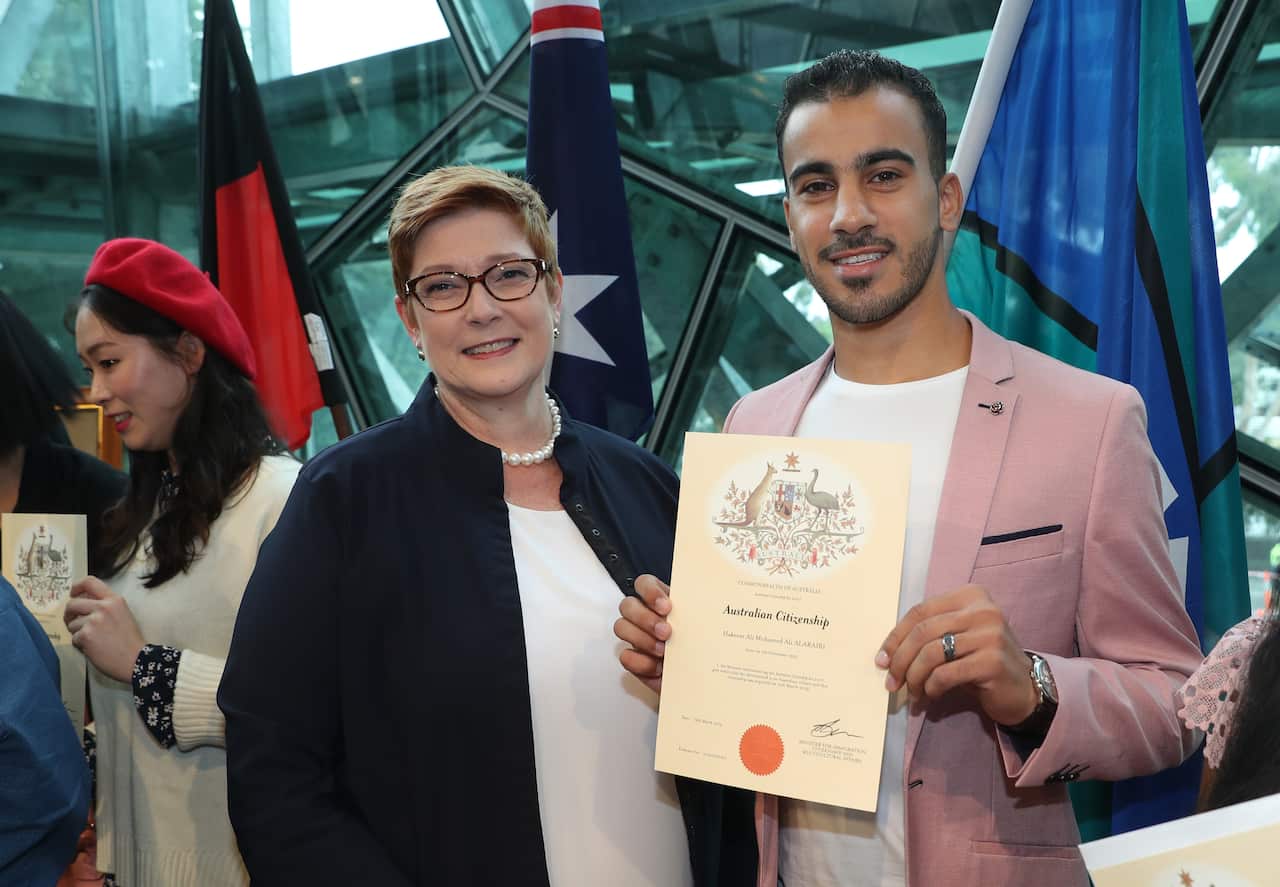 Minister for Foreign Affairs Marise Payne and refugee footballer Hakeem Al-Araibi who received his Australian citizenship during a ceremony in Melbourne.