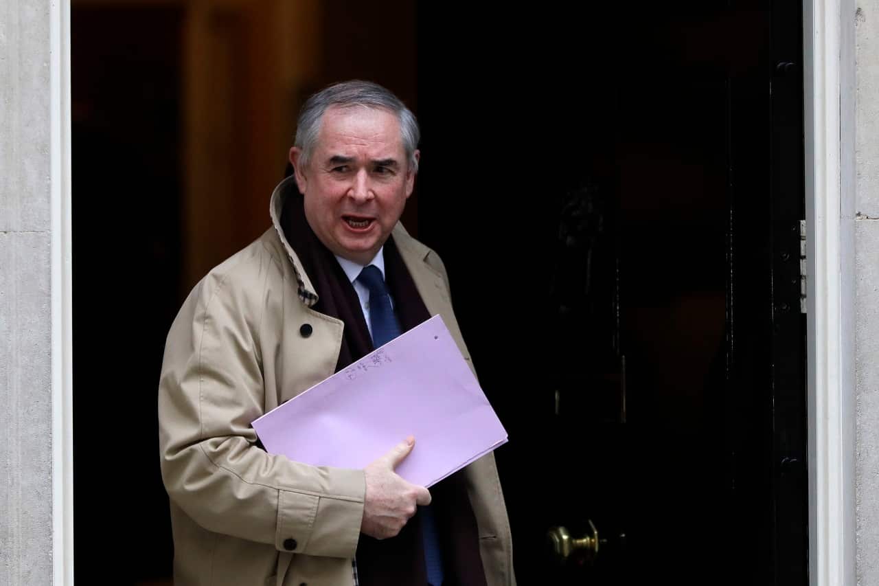 Britain's Attorney General Geoffrey Cox leaves from Downing Street.