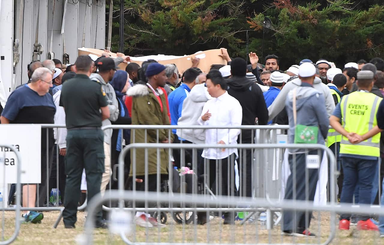 Mourners carry the casket of Tariq Rashid Omar, aged 24, at the Memorial Park Cemetery in Christchurch, New Zealand.
