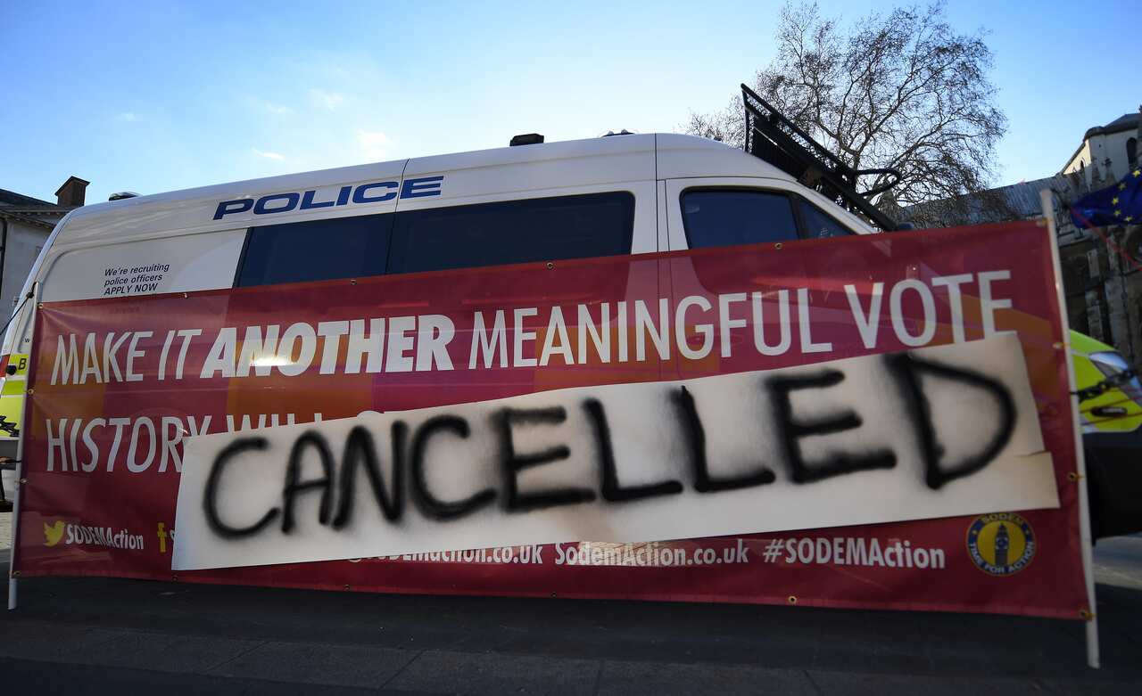 Pro EU campaigners place a banner outside the British Houses of Parliament in London, Britain, 25 March 2019.