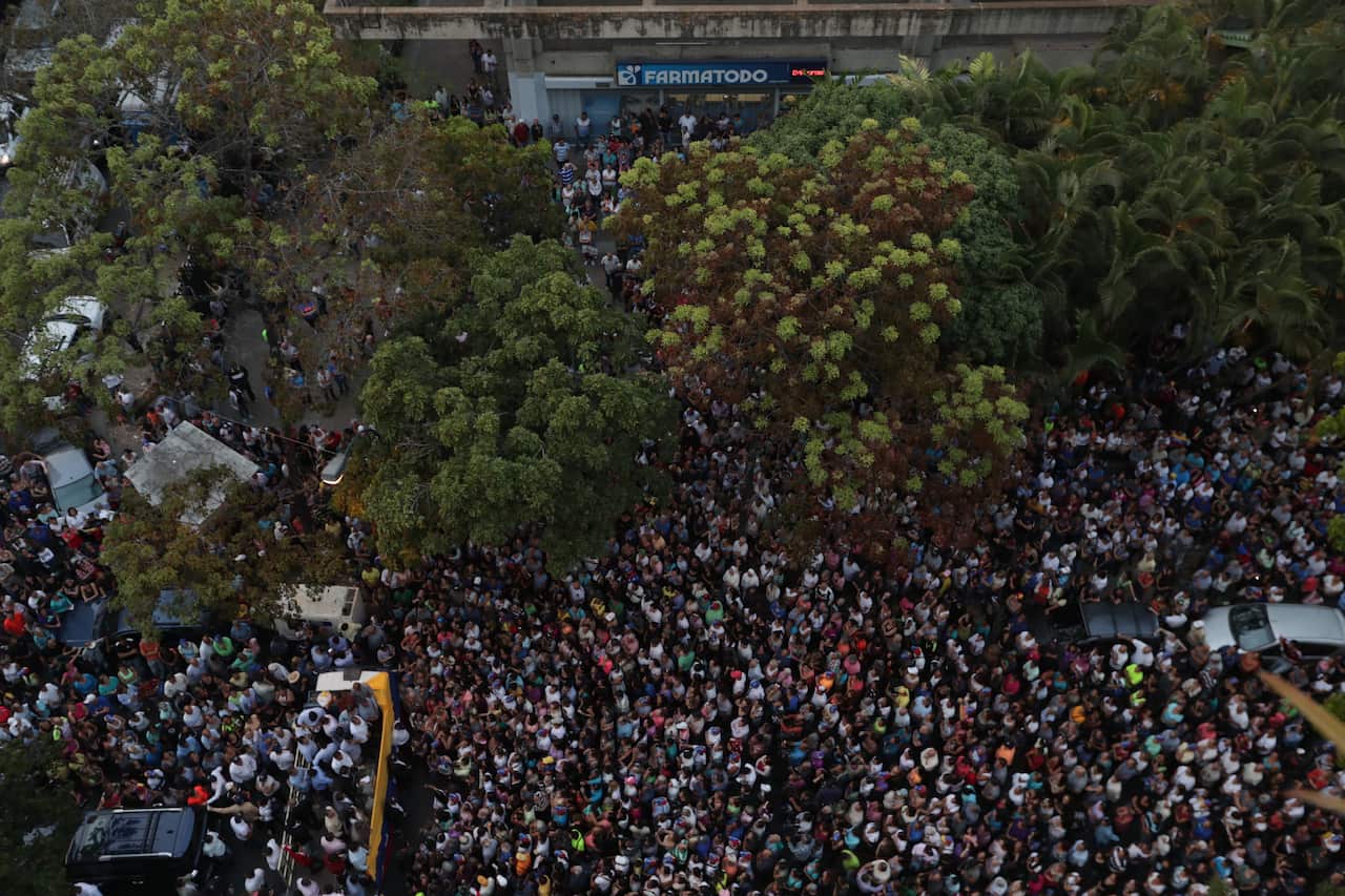 epa07469761 People attend an event of Venezuelan National Assembly President Juan Guaido, in Montalban, south Caracas, Venezuela, 28 March 2019.  EPA/RAYNER PENA