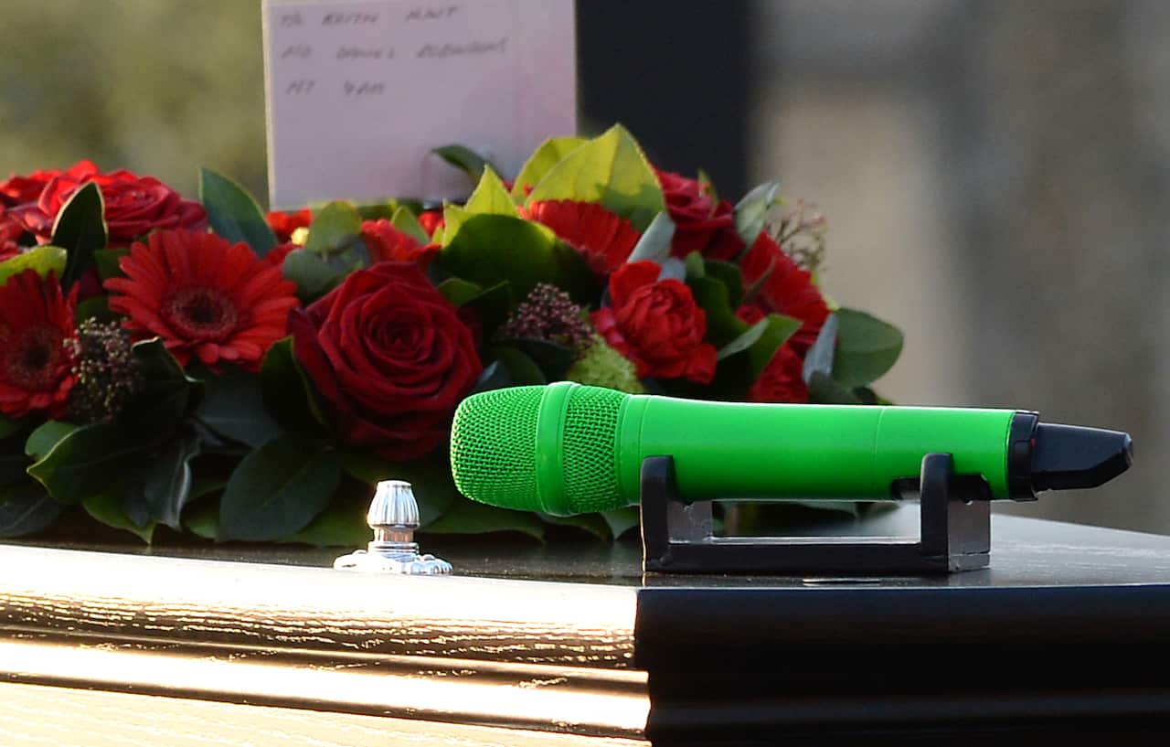 Close up of the coffin being carried outside St. Mary's Church.