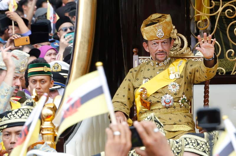 Brunei's Sultan Hassanal Bolkiah waves to well-wishers during a procession as part of the Golden Jubilee celebrations in Bandar Seri Begawan, Brunei.
