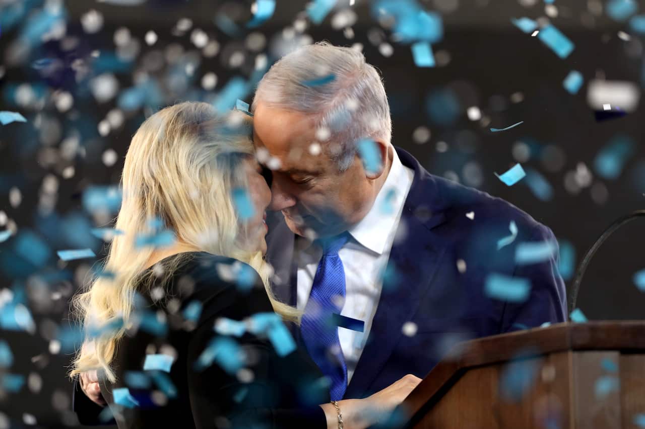 Israel's Prime Minister Benjamin Netanyahu (R) and his wife Sarah (L) celebrate following the election in Tel Aviv, Israel.