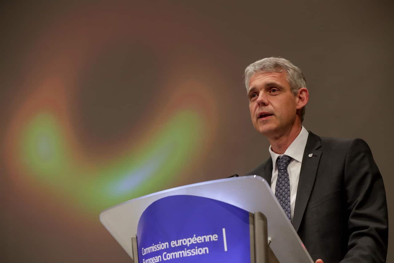 Heino Falcke, professor at the Radboud University in Nijmegen unveils the first image ever of a black hole during a press conference at the European Commission in Brussels, Belgium.