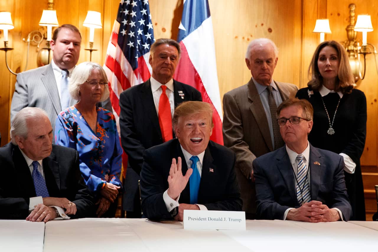 President Donald Trump speaks with reporters about border policy during a fundraising event, Wednesday.