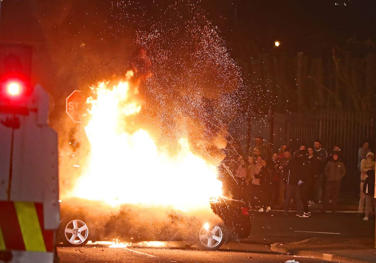 A hijacked car explodes after being set on fire in Creggan, Londonderry.. Picture date: Thursday April 18, 2019. Photo credit should read: Niall Carson/PA Wire