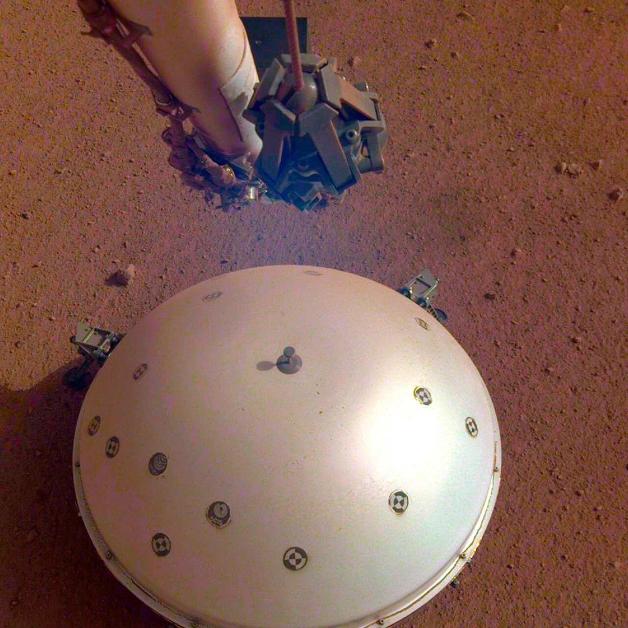 The InSight lander's domed wind and thermal shield covers a seismometer.