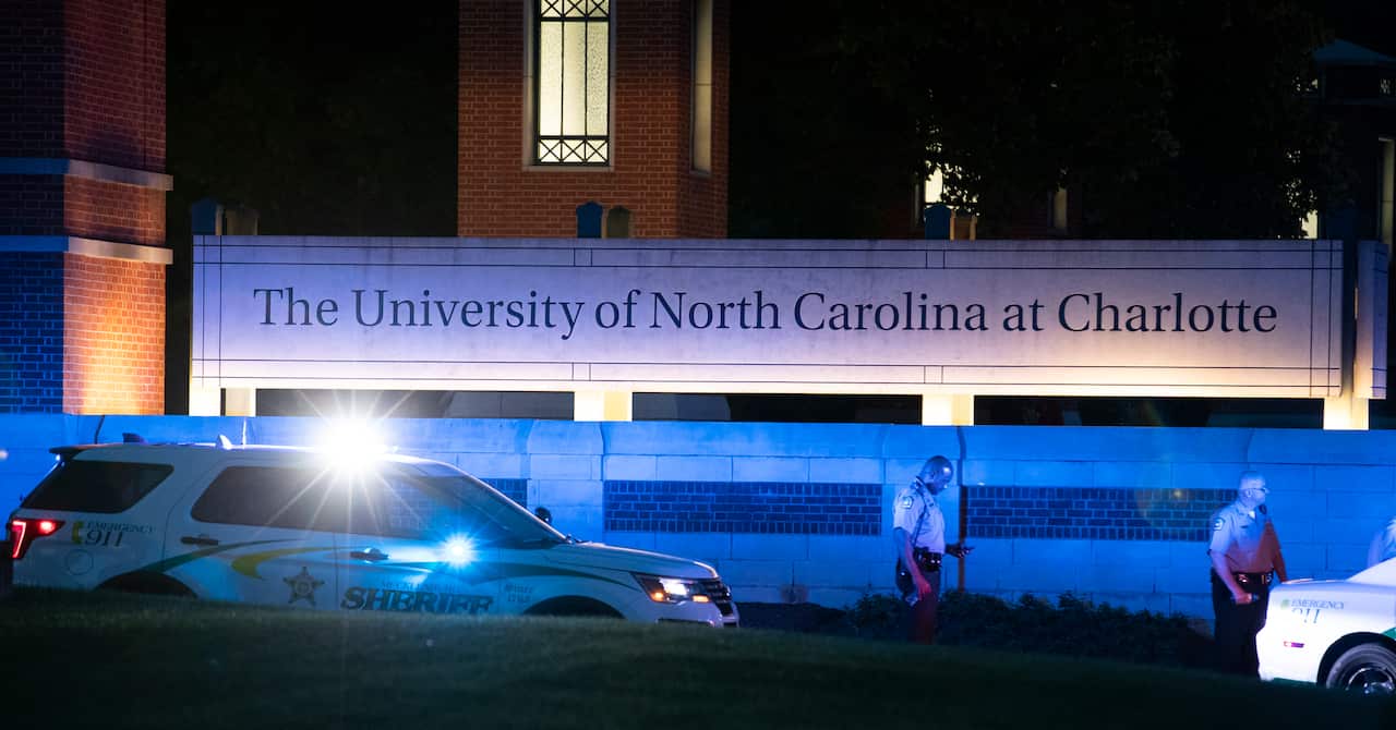 Police secure the main entrance to UNC Charlotte after a shooting at the school that left at least two people dead, Tuesday, April 30, 2019, in Charlotte, N.C. (AP Photo/Jason E. Miczek)