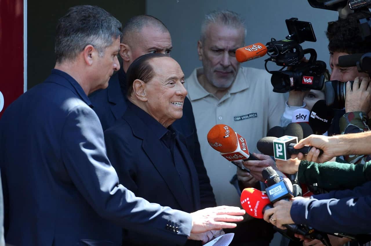 Former Italian prime minister Silvio Berlusconi addresses the media as he leaves San Raffaele Hospital.