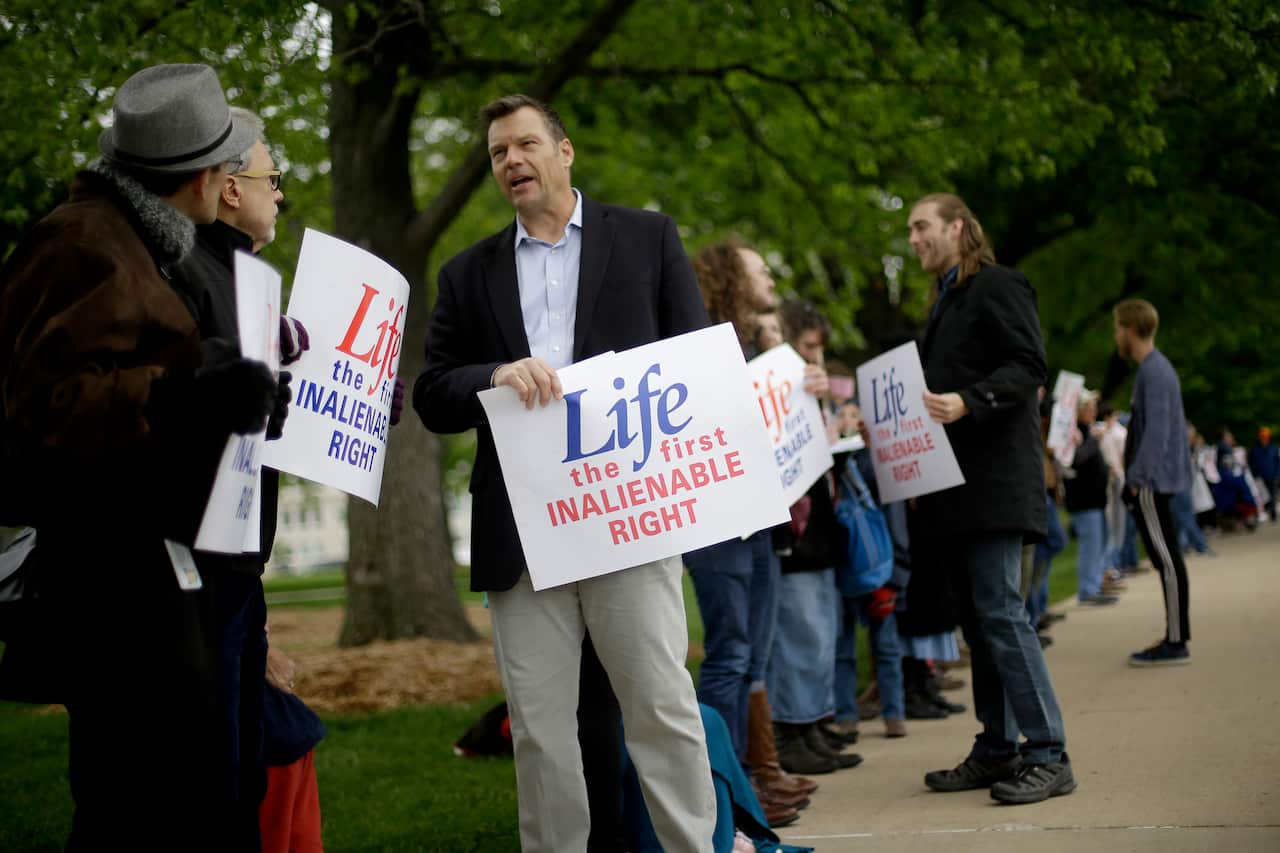 About 100 anti-abortion demonstrators also protested in Kansas this week.