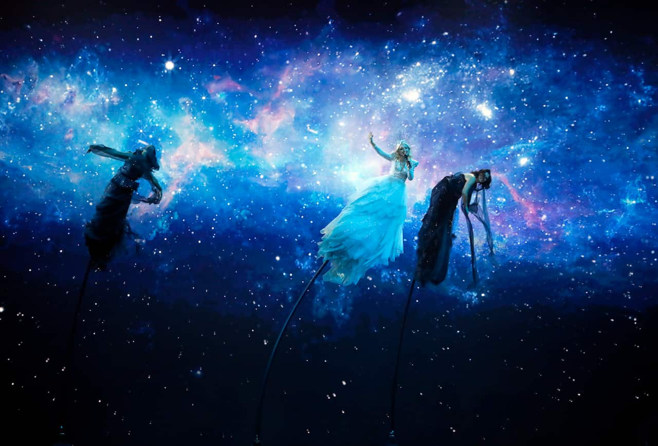 Kate Miller-Heidke of Australia, center, performs the song "Zero Gravity" during the 2019 Eurovision Song Contest grand final in Tel Aviv, Israel, Saturday, May 18, 2019. (AP Photo/Sebastian Scheiner)