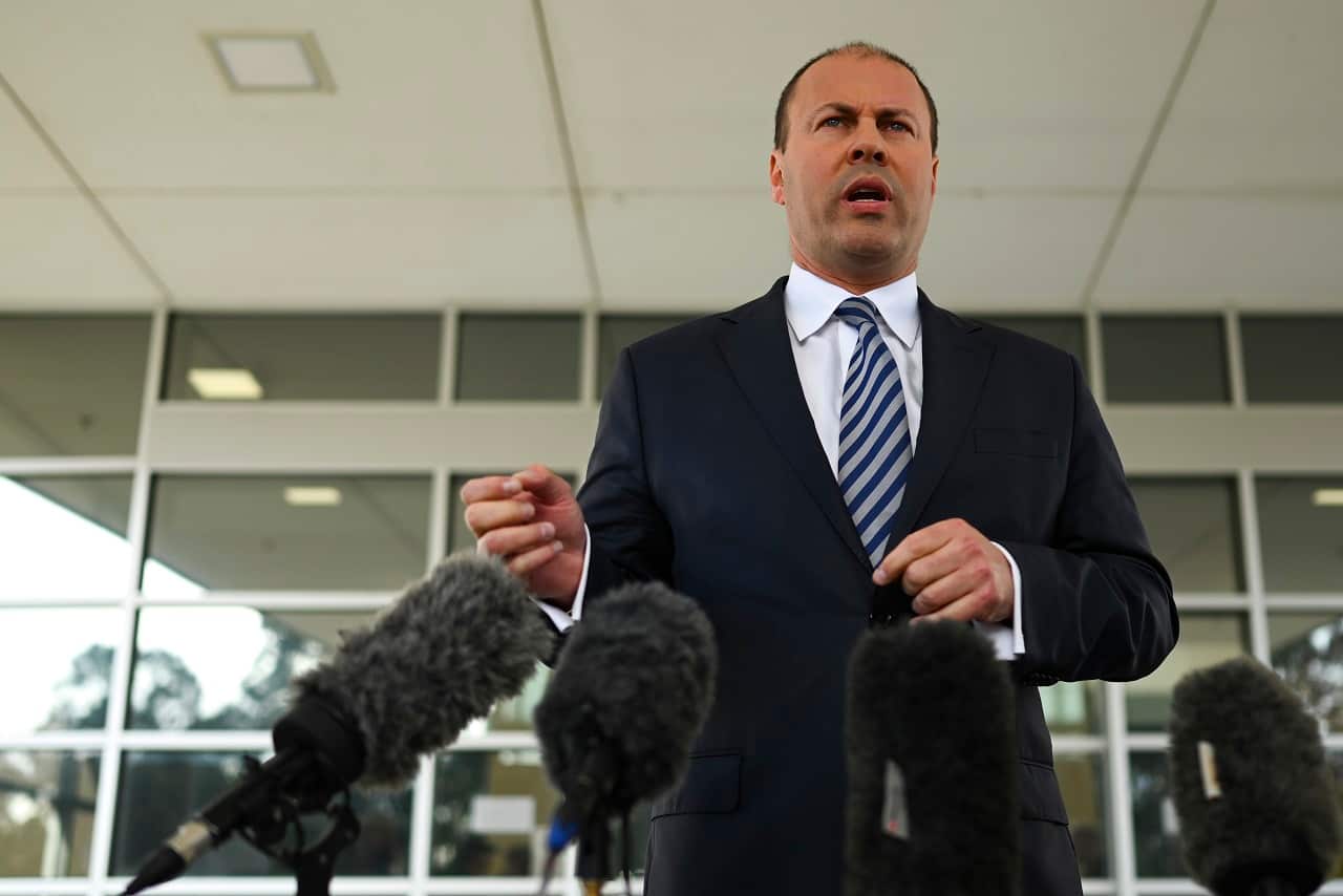 Treasurer Josh Frydenberg talks to reporters on Monday.