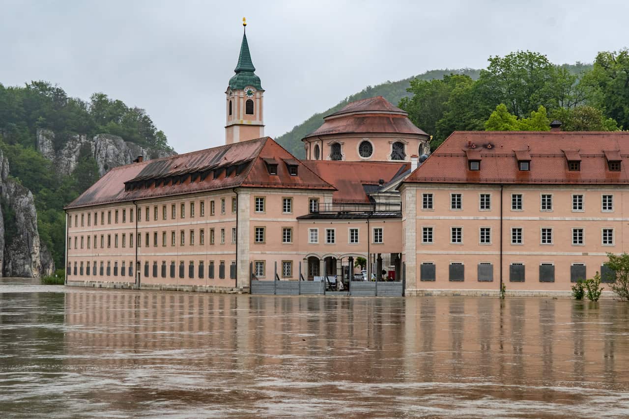 The monastery Weltenburg is flooded from the Danube river after heavy rain falls in Weltenburg, southern Germany, Wednesday, May 22,2019.(Armin Weigel/dpa via AP)
