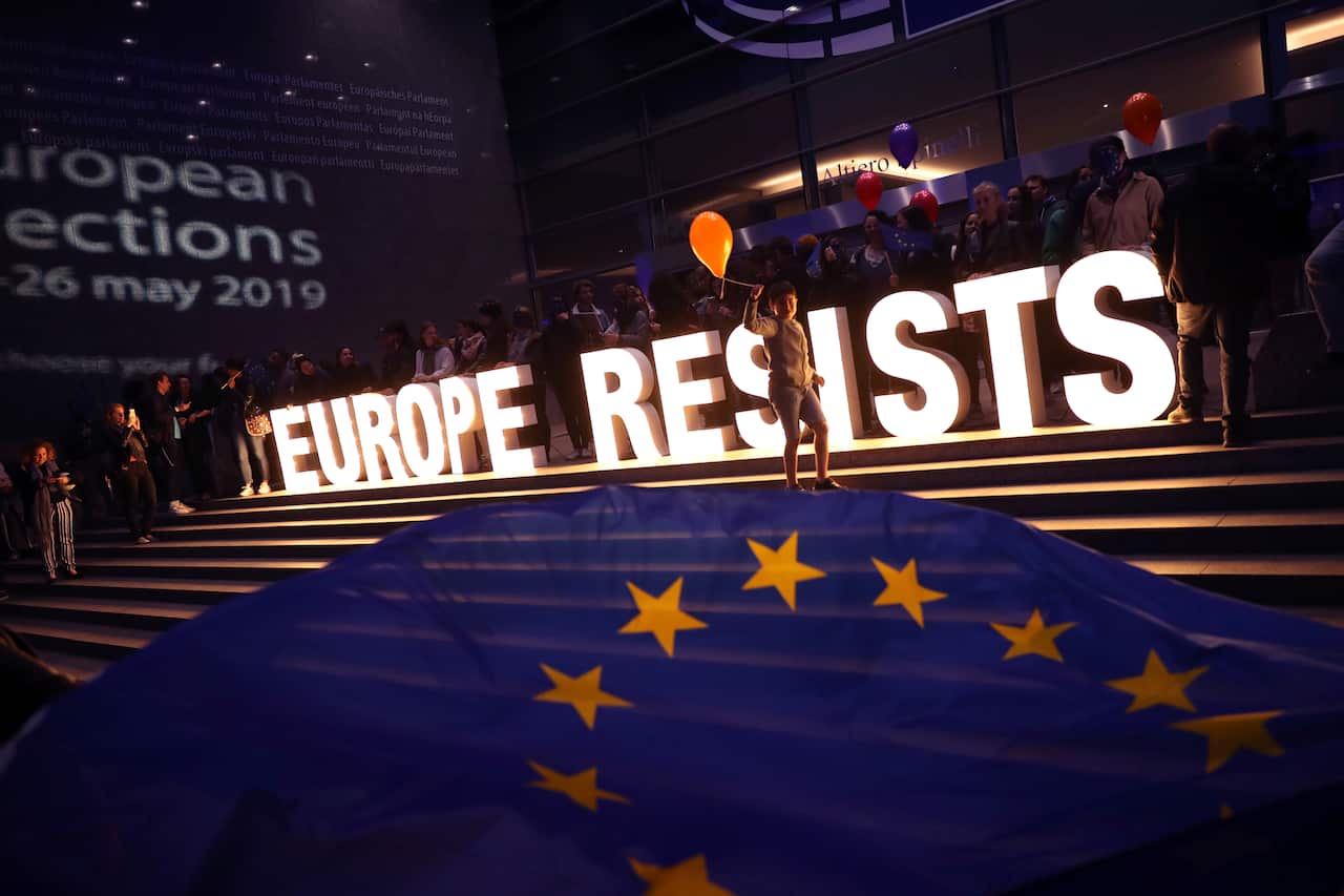 A sign erected by climate activists outside the European Parliament in Brussels.