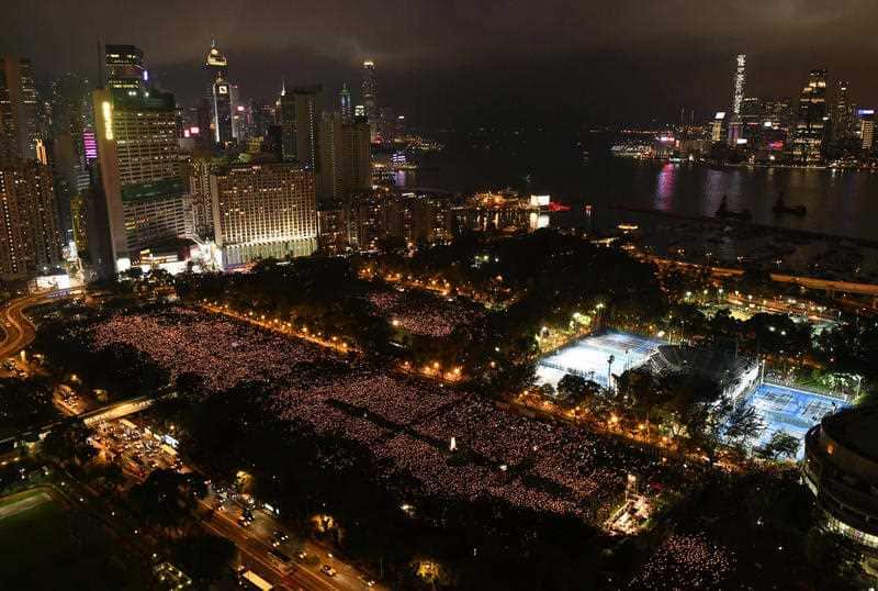 Thousands attend a candlelight vigil three decades on from the Chinese government's military crackdown on protesters in Beijing's Tiananmen Square